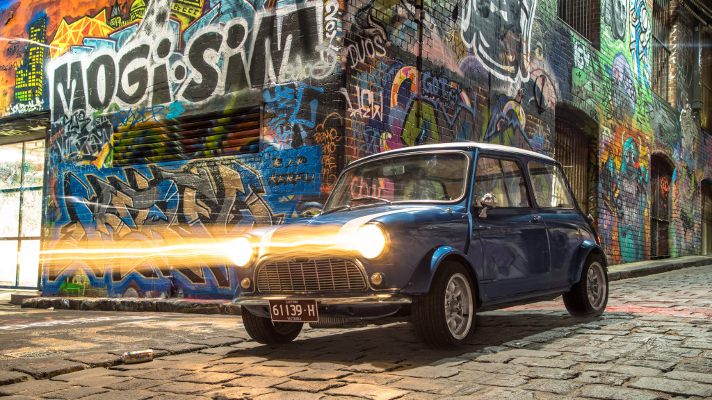 Mini with headlights on in Hosier Lane